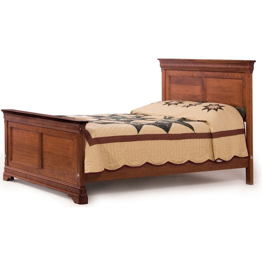 Panel bed in cherry made up with a tan and green star quilt, showing raised panel head and footboards