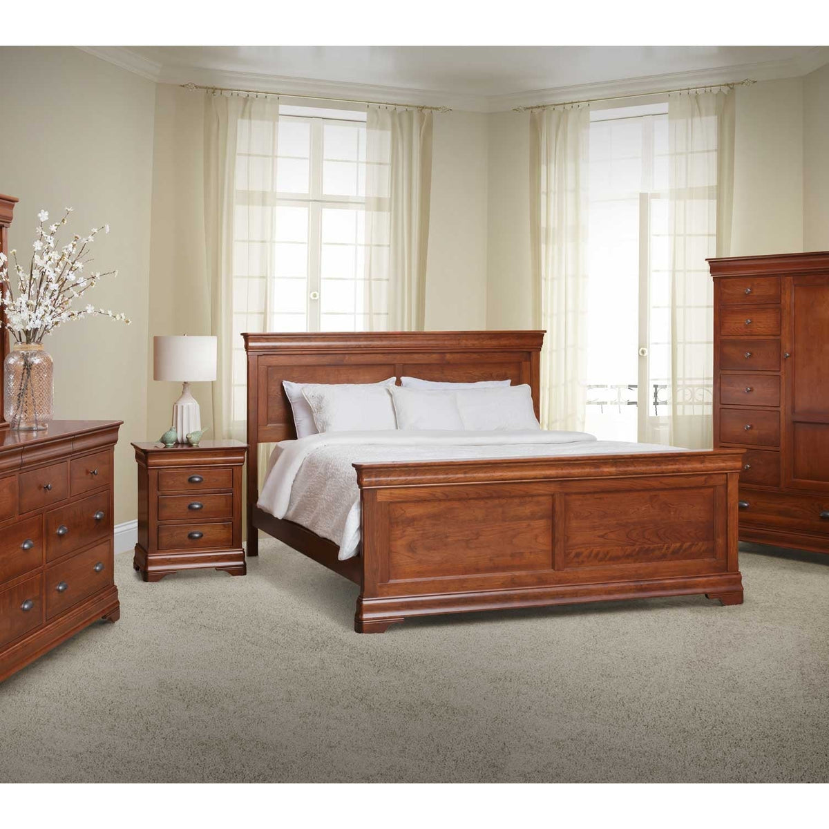 Cherry panel bed styled in a bright bedroom with a nightstand, dresser and tall door chest on carpet