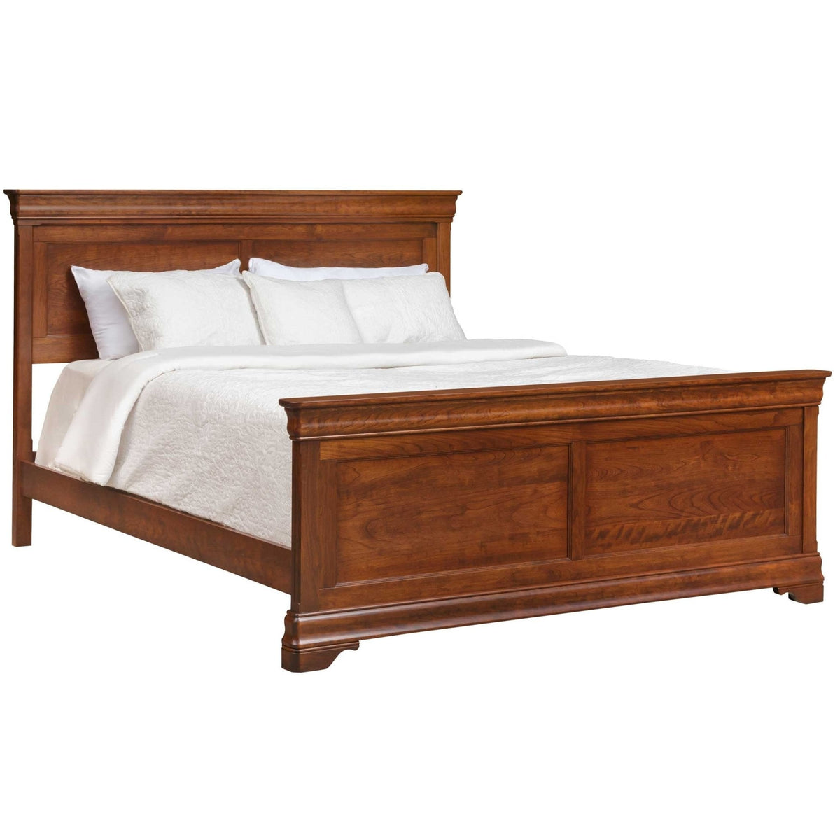Studio angle of the cherry panel bed showing the molded headboard crown, paneled footboard and bracket feet