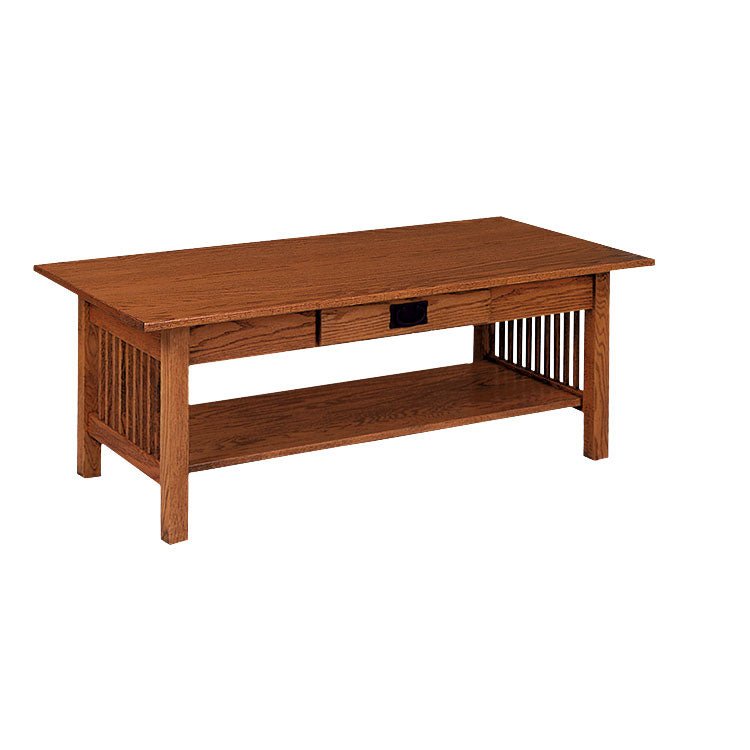 Oak Mission coffee table with a center drawer, spindle sides and lower display shelf holding books and a bowl