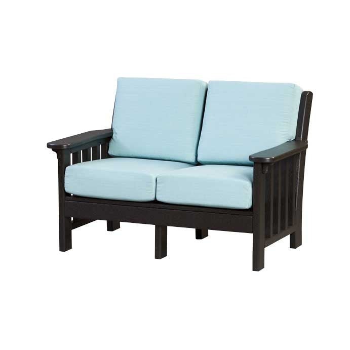 Blue poly Mission cushion loveseat with wide striped seat and back cushions on a paver patio