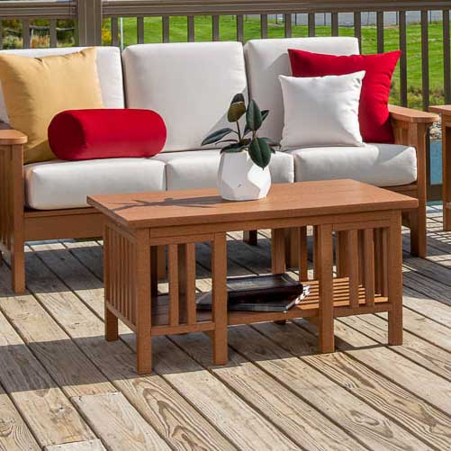 Cedar poly Mission coffee table with slatted sides and lower shelf in front of a white cushioned sofa