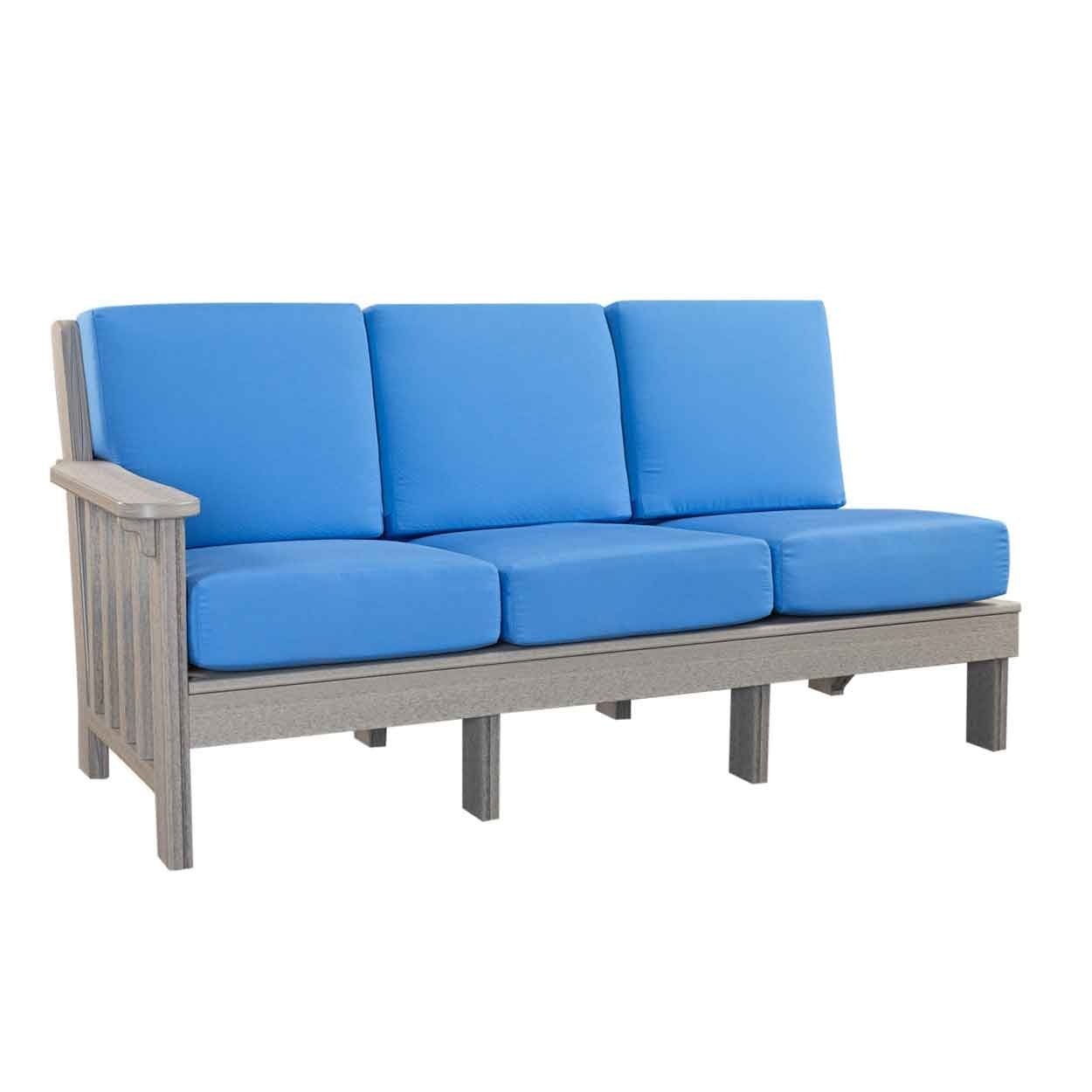 Brown poly L shaped sectional sofa with beige cushions around a lit fire table under string lights