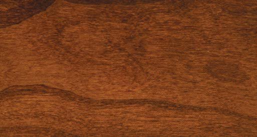 Mission stain on cherry wood sample, a rich reddish brown plank with flowing cathedral grain