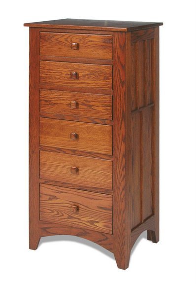 Tall narrow six-drawer Mission lingerie chest in oak, shown at an angle with paneled side and shaped feet