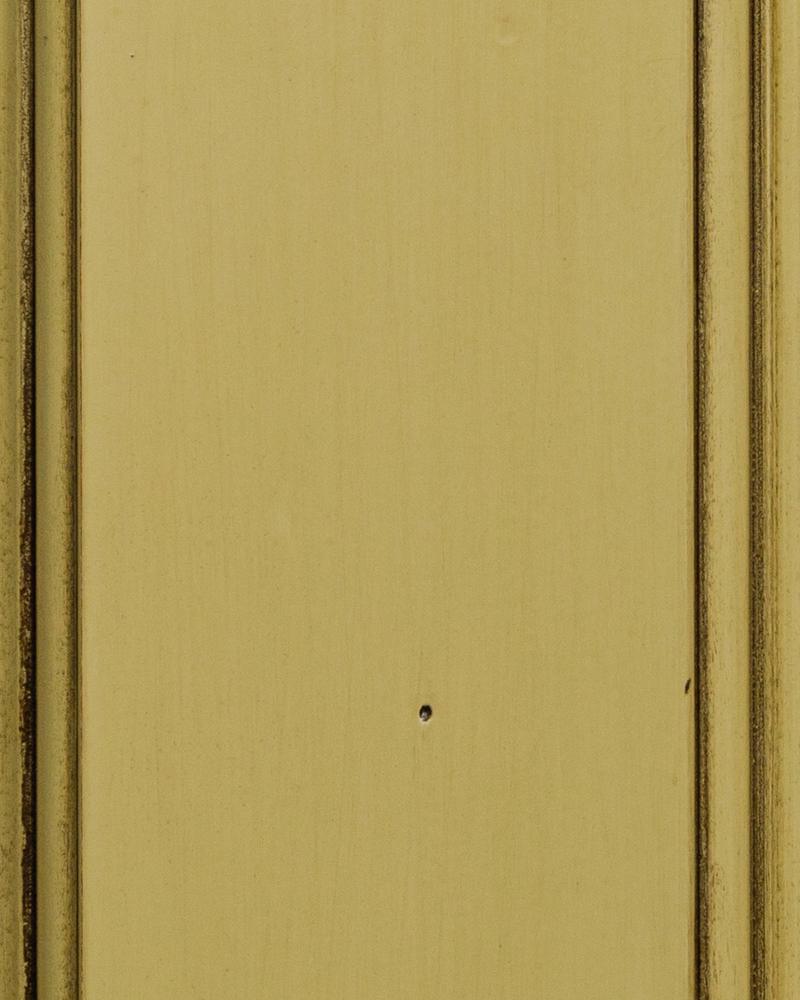 Moss Heritage paint sample in a muted olive green with dark rubbed edges along the beaded frame