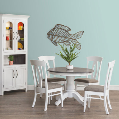 White pedestal dining table with a gray top, four white chairs with fabric seats and a white corner hutch