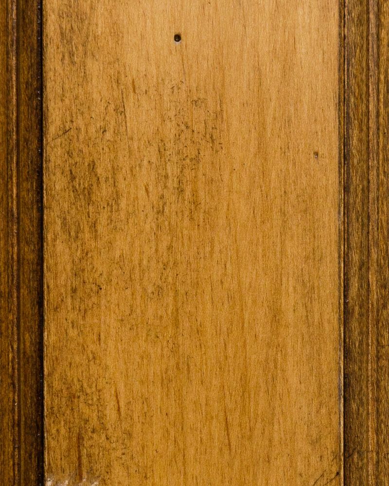Palm Renaissance stain on maple showing a golden honey brown panel with faint brushed distressing