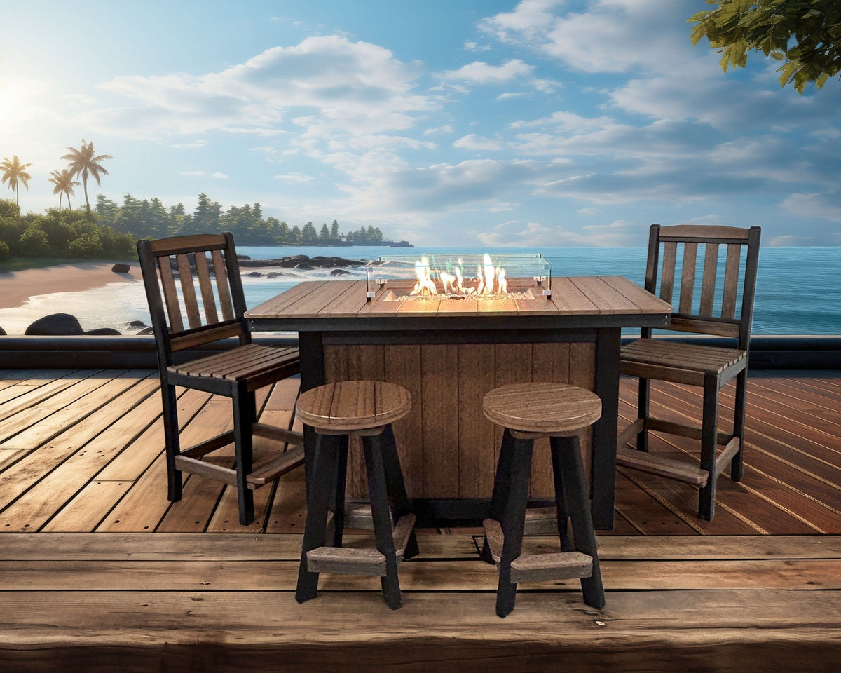 Brown and black poly bar height fire pit dining island with a lit glass surrounded burner, two chairs and stools by the sea