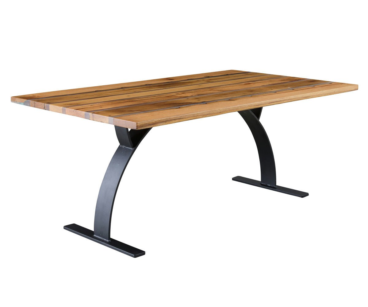 Farm dining table with alternating reclaimed oak planks and gray resin inlays on arched black metal legs