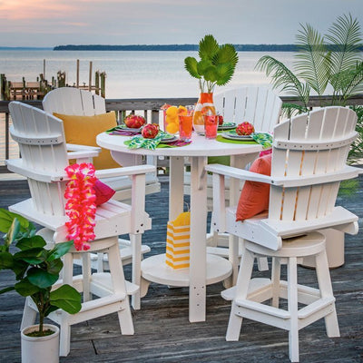White poly 42 inch round bar height patio table with four swivel Adirondack chairs set for a party on a bay deck