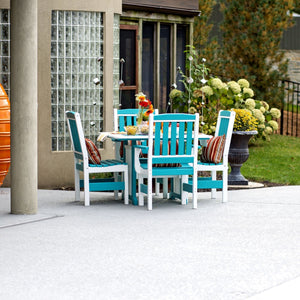Aruba blue and white poly patio dining set with square table and four slatted arm chairs on a concrete patio by gardens