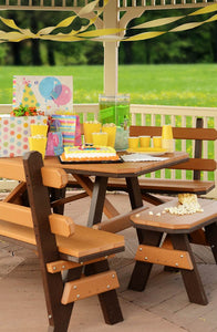 Cedar and brown poly garden table with backed benches set with a birthday cake, popcorn and yellow cups on a deck