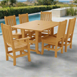 Natural teak poly dining set with a 60 inch table, umbrella hole and six mission slat back chairs by a pool