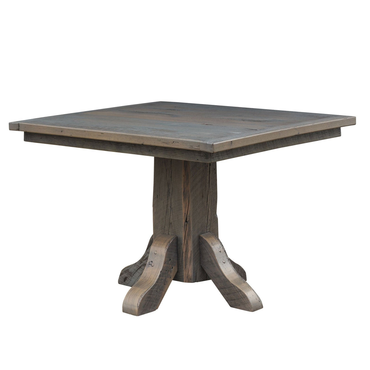 Square reclaimed wood dining table in a driftwood gray finish on a chunky four footed pedestal base