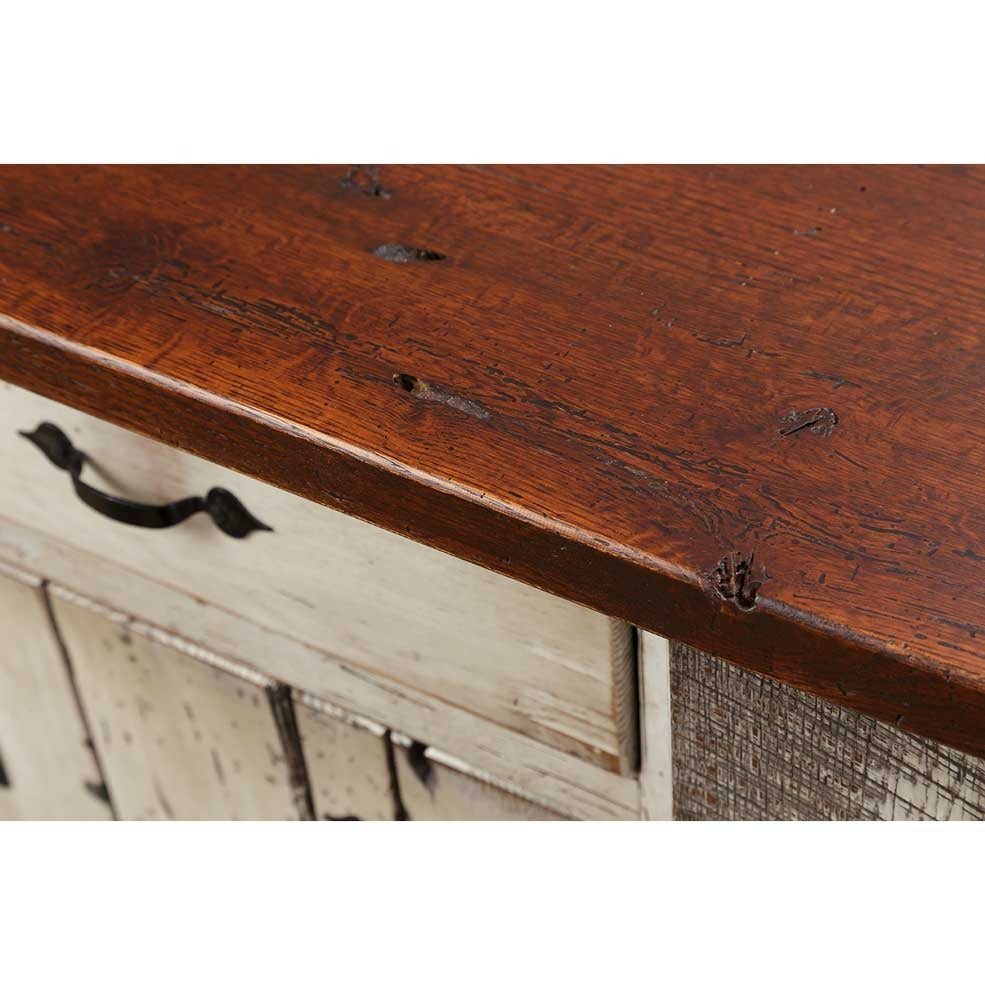 Corner detail of the island's thick reclaimed oak top showing nail holes, knots and a rich stained finish
