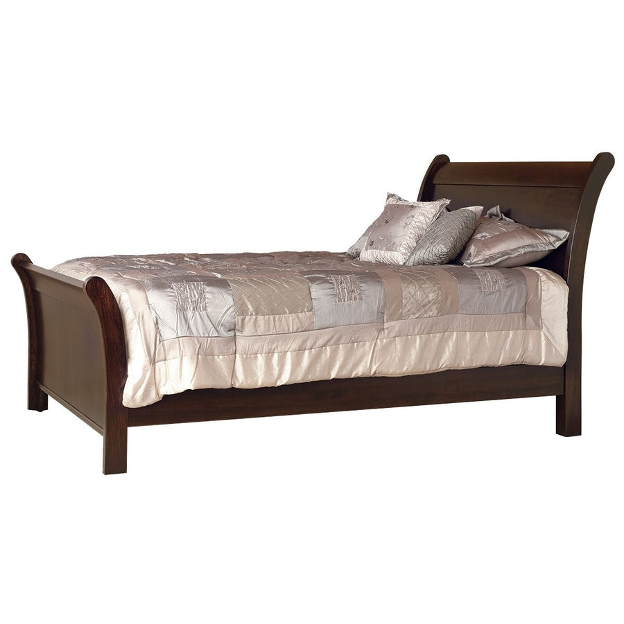 Espresso finished wood sleigh bed with scrolled headboard and footboard, made up with a champagne satin comforter and pillows