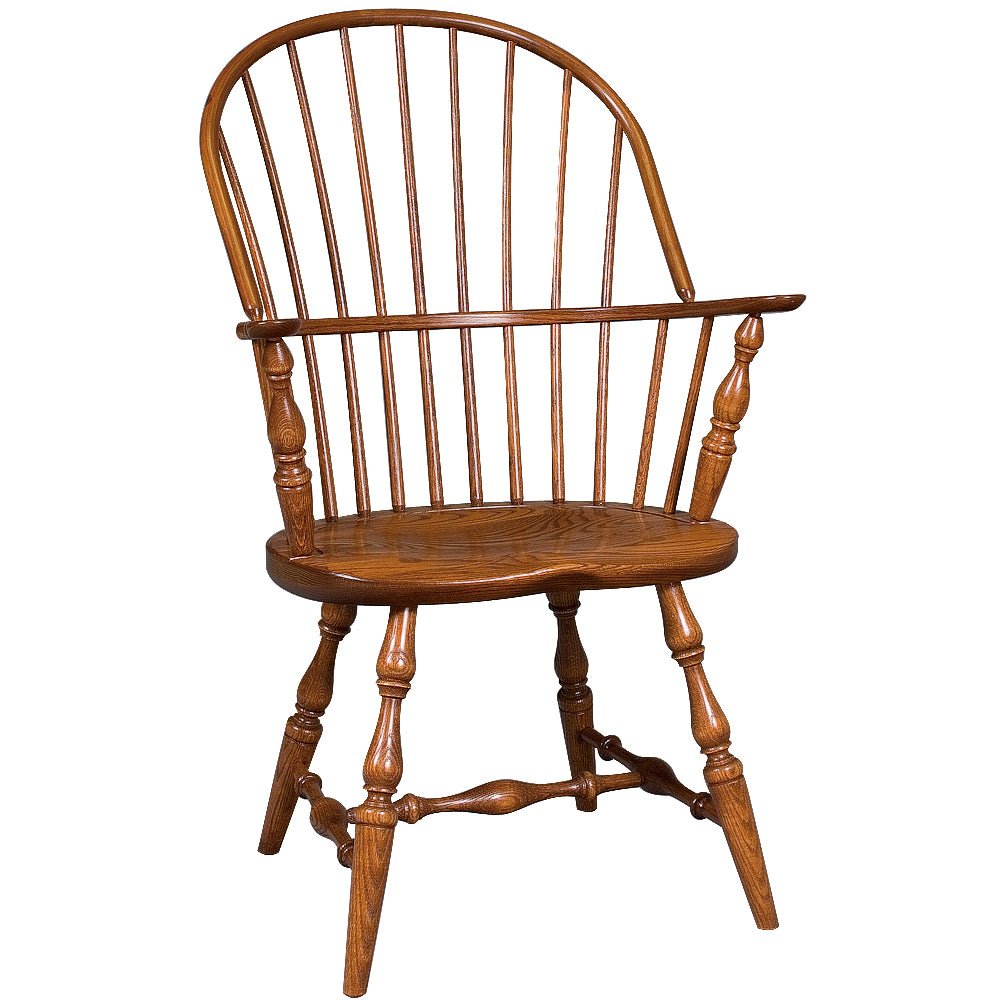 Oak sack back Windsor arm chair with bowed spindle back, saddle seat, turned legs and H-stretcher on a white background