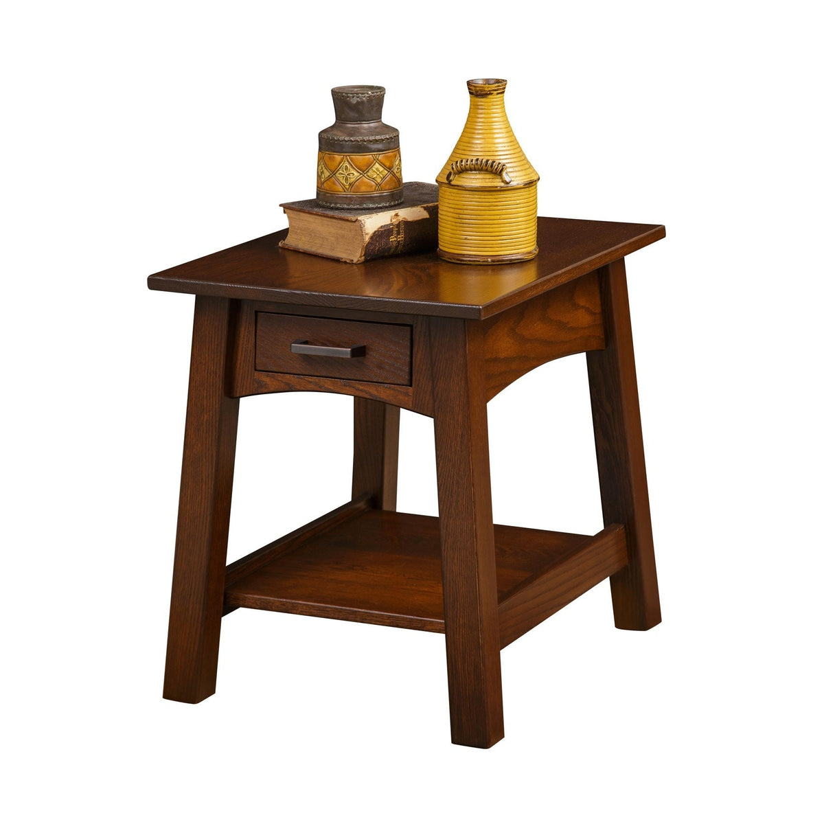 Santa Fe end table in dark oak topped with a yellow ribbed vase, tin canister and worn leather book
