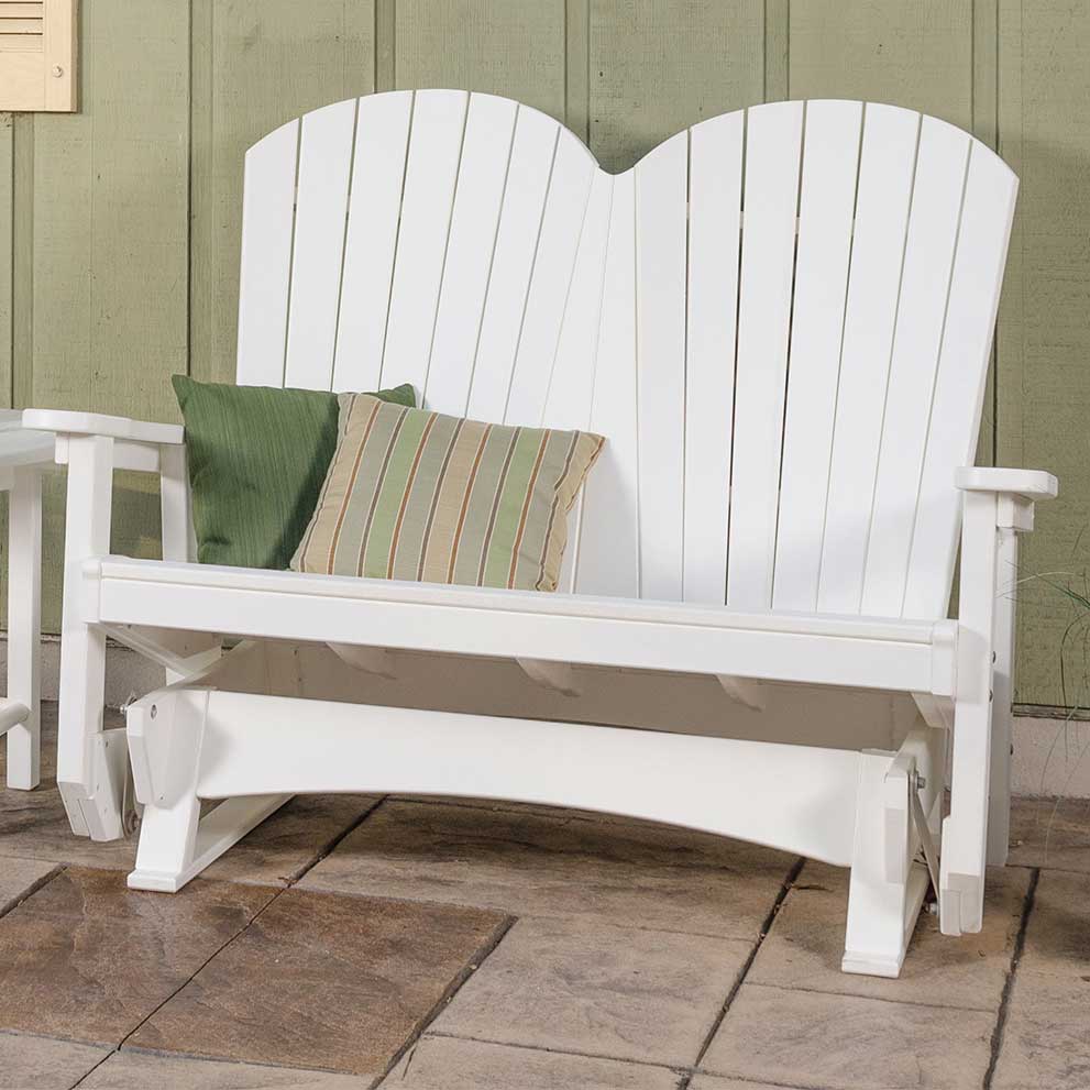 Close-up of the white poly Adirondack glider bench showing the fanback slats, wide arms and glider base on a stone patio