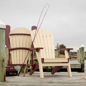 Cream and cherry poly Adirondack chair on a weathered dock with fishing rods and a folded second chair behind