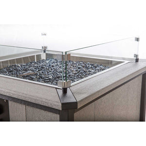 Detail of the tempered glass wind guard bracket and mitered top edge on a gray square fire pit table