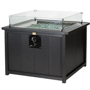 Black square poly fire pit table with paneled sides, gas control panel and clear glass wind guard over fire glass