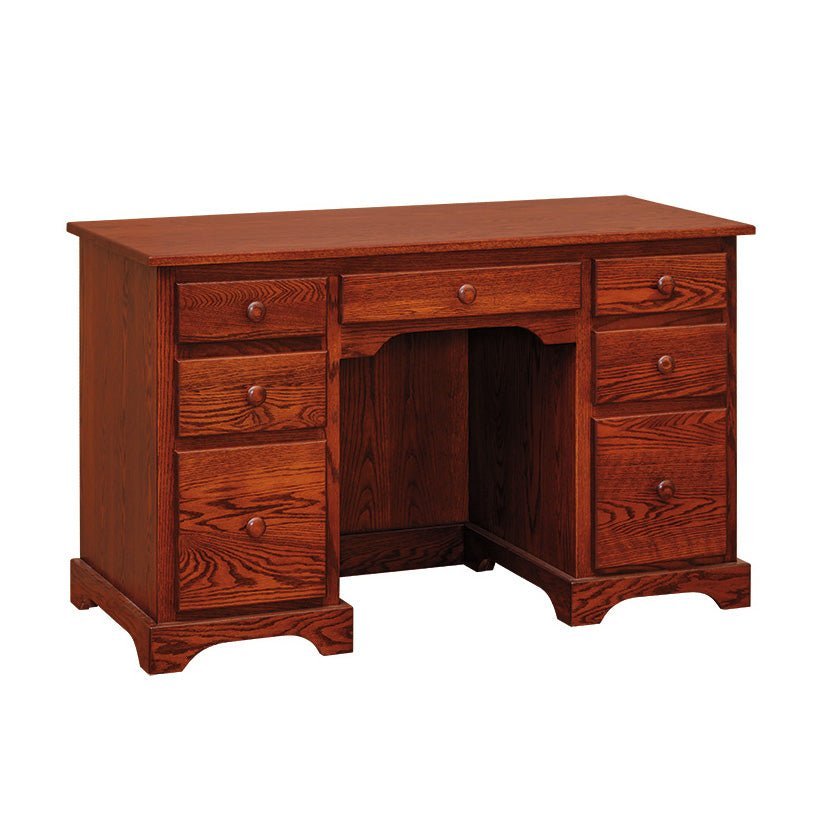 Oak flattop writing desk in a warm cherry stain with a center drawer and two banks of three drawers