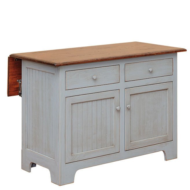 Soft blue kitchen island with the side drop leaf folded down, showing two drawers and two beadboard cabinet doors