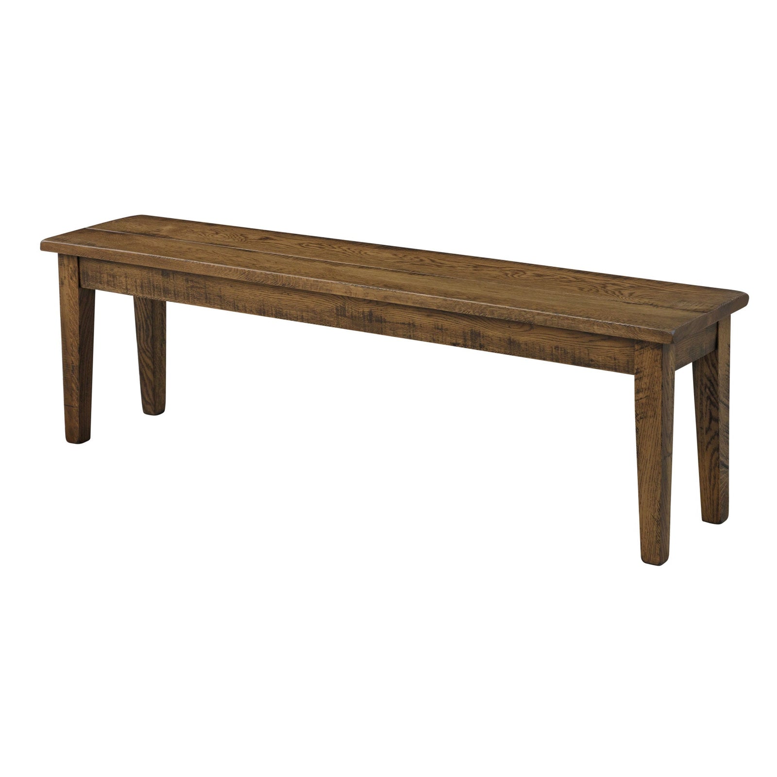 Rustic oak dining bench with a plank seat and tapered legs, tucked under a matching farmhouse table with greenery and a basket