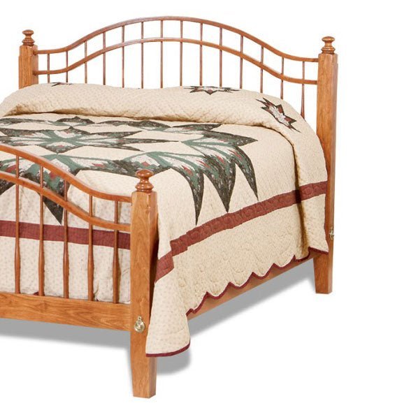 Cherry spindle headboard and footboard with arched top rails, turned posts and a patchwork quilt