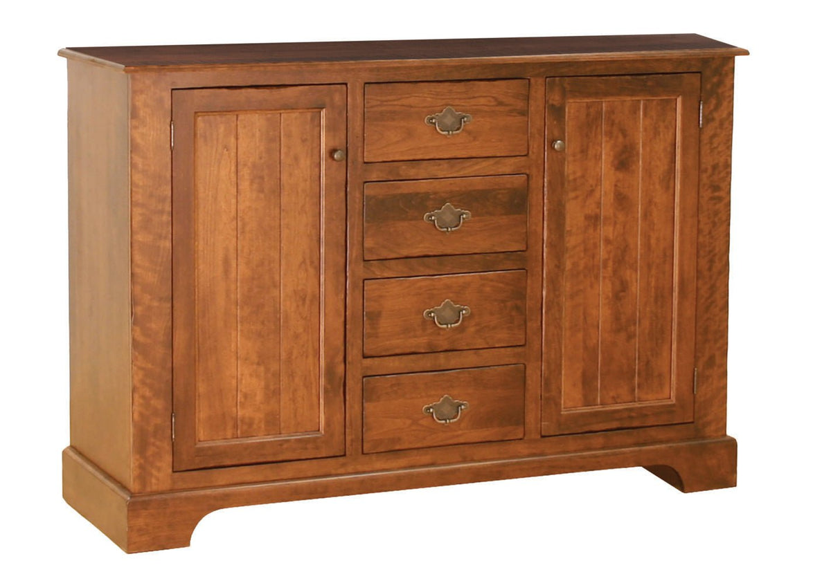 Sideboard buffet base in cherry with two paneled doors flanking four drawers with antique brass bail pulls