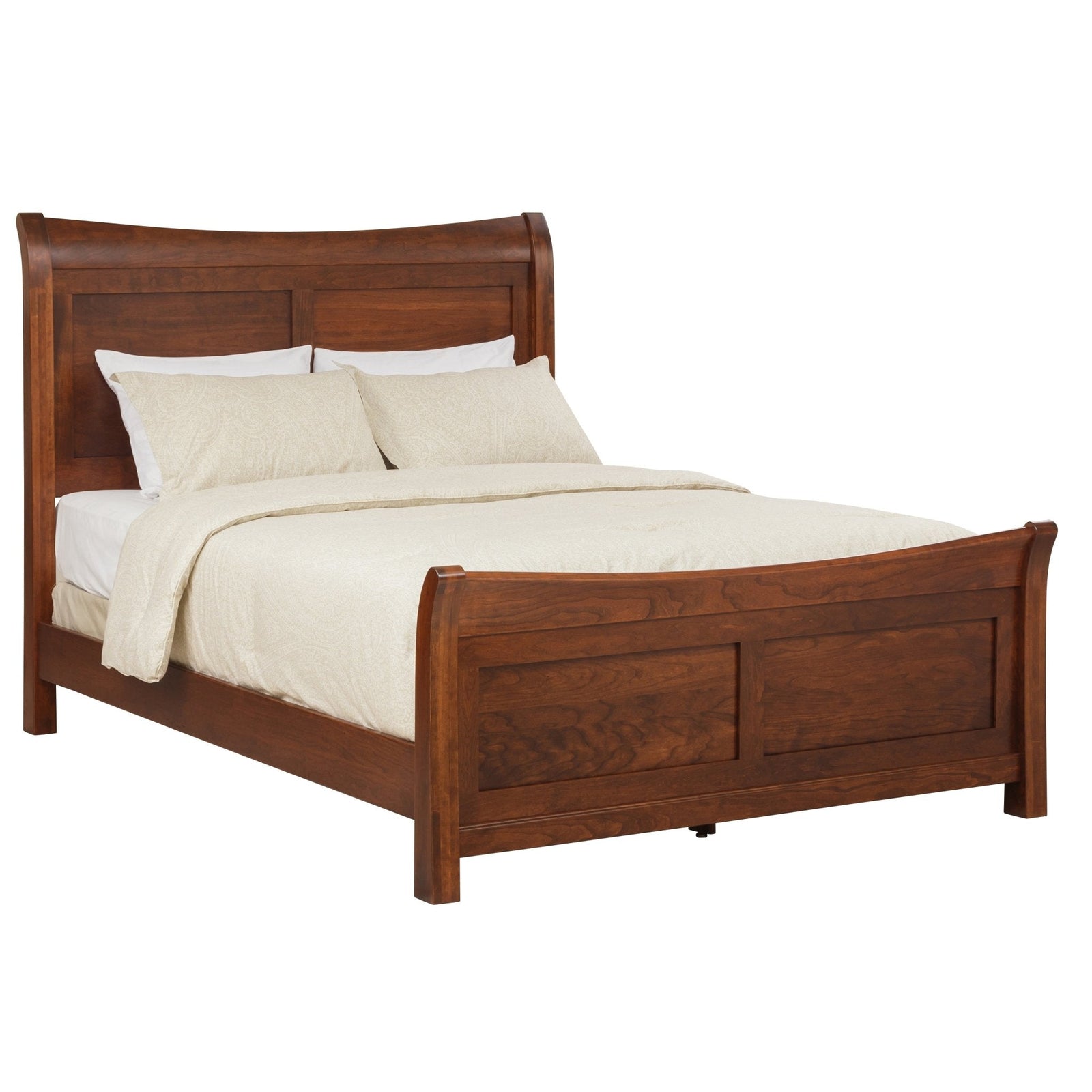 Cherry finished sleigh bed with a curved paneled headboard and matching footboard, dresser and nightstand in a warm bedroom