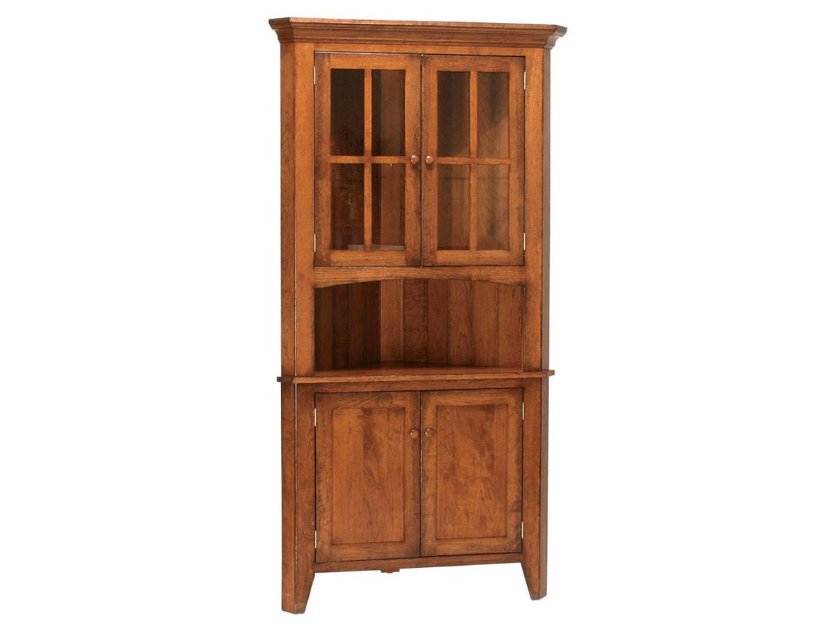 Cherry corner china cabinet with two glass mullion doors, open display shelf and paneled lower storage doors