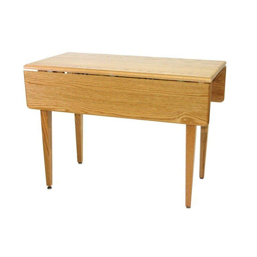 Oak drop leaf dining table with one leaf lowered, rounded corners and tapered legs on a white background