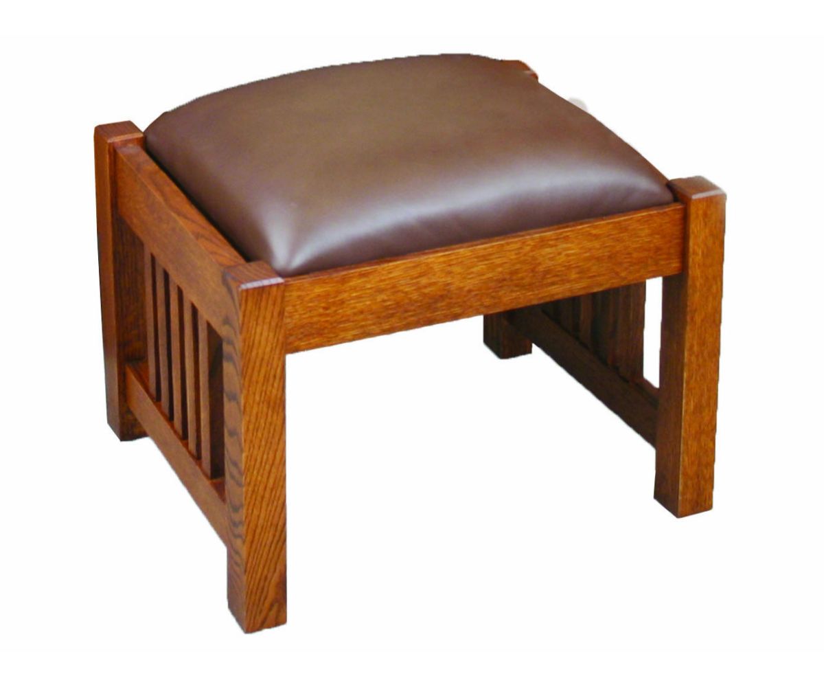 Mission ottoman with a rust leather top and oak spindle sides, positioned in front of a Morris chair by a coffee table