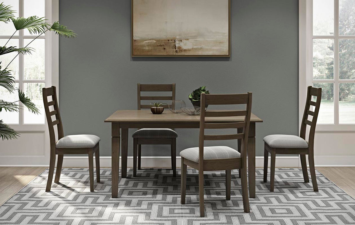 Dining room with a light oak leg table, four ladder-back chairs with patterned seats and a geometric rug