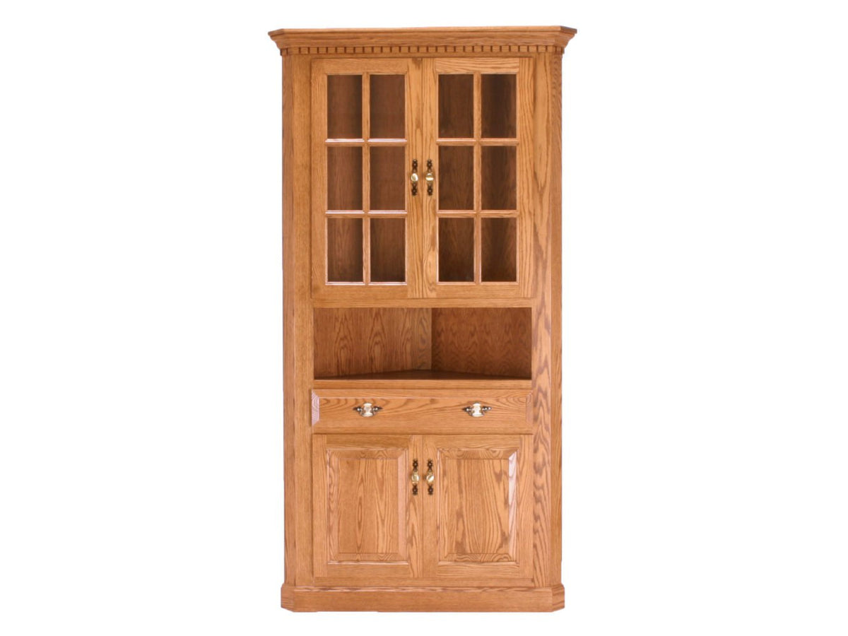 Traditional oak china corner hutch with glass mullion doors, dentil crown molding, open shelf, drawer and paneled doors