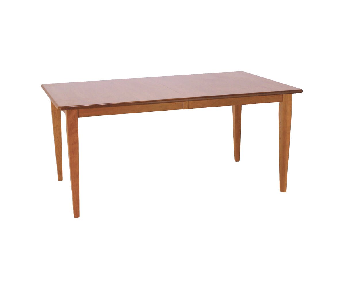 Valley Shaker dining table in cherry with a rectangular top, center leaf seam, plain apron and tapered legs