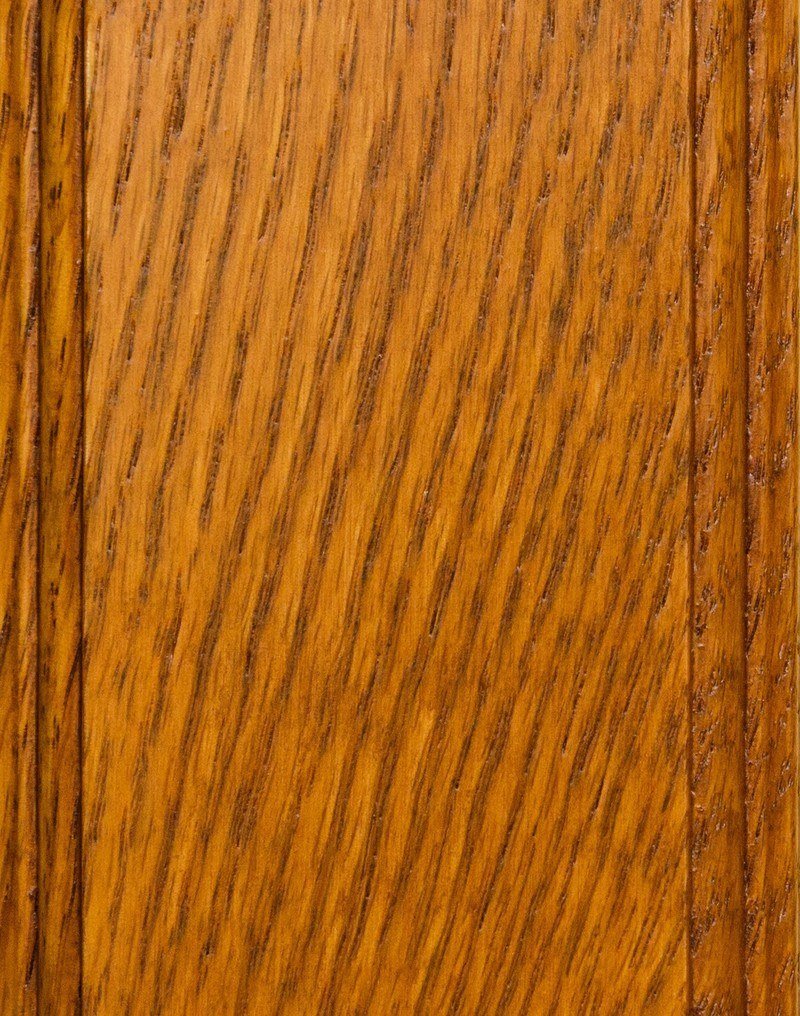 Spice Heritage stain on oak showing a bright golden amber finish over open oak grain texture