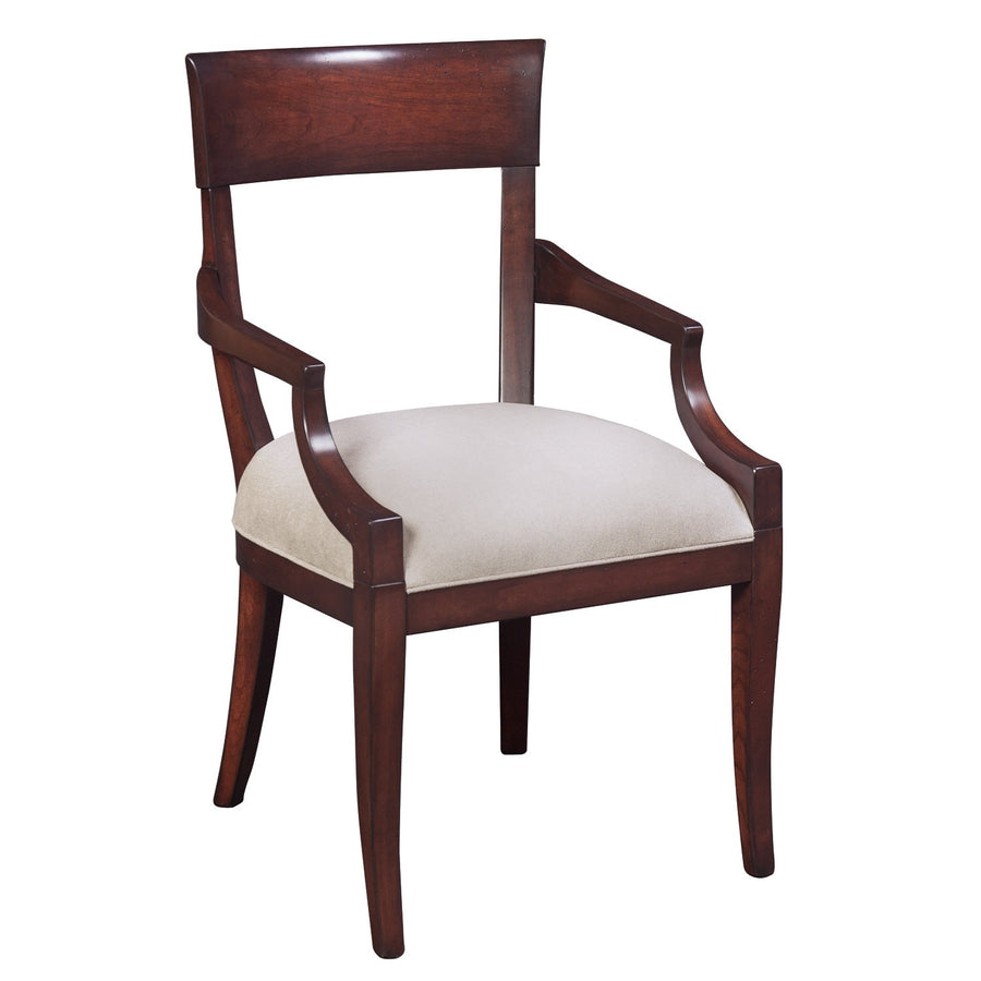 Cherry dining arm chair with a curved crest panel back, sloped open arms, cream cushion seat and saber legs