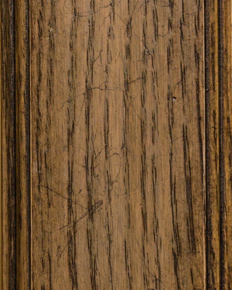 Stonewerk Renaissance stain on oak showing an olive brown finish with heavy black grain and cracks