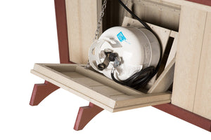 Open drop-down door on a poly fire table base revealing the propane tank on a tray with hose and regulator