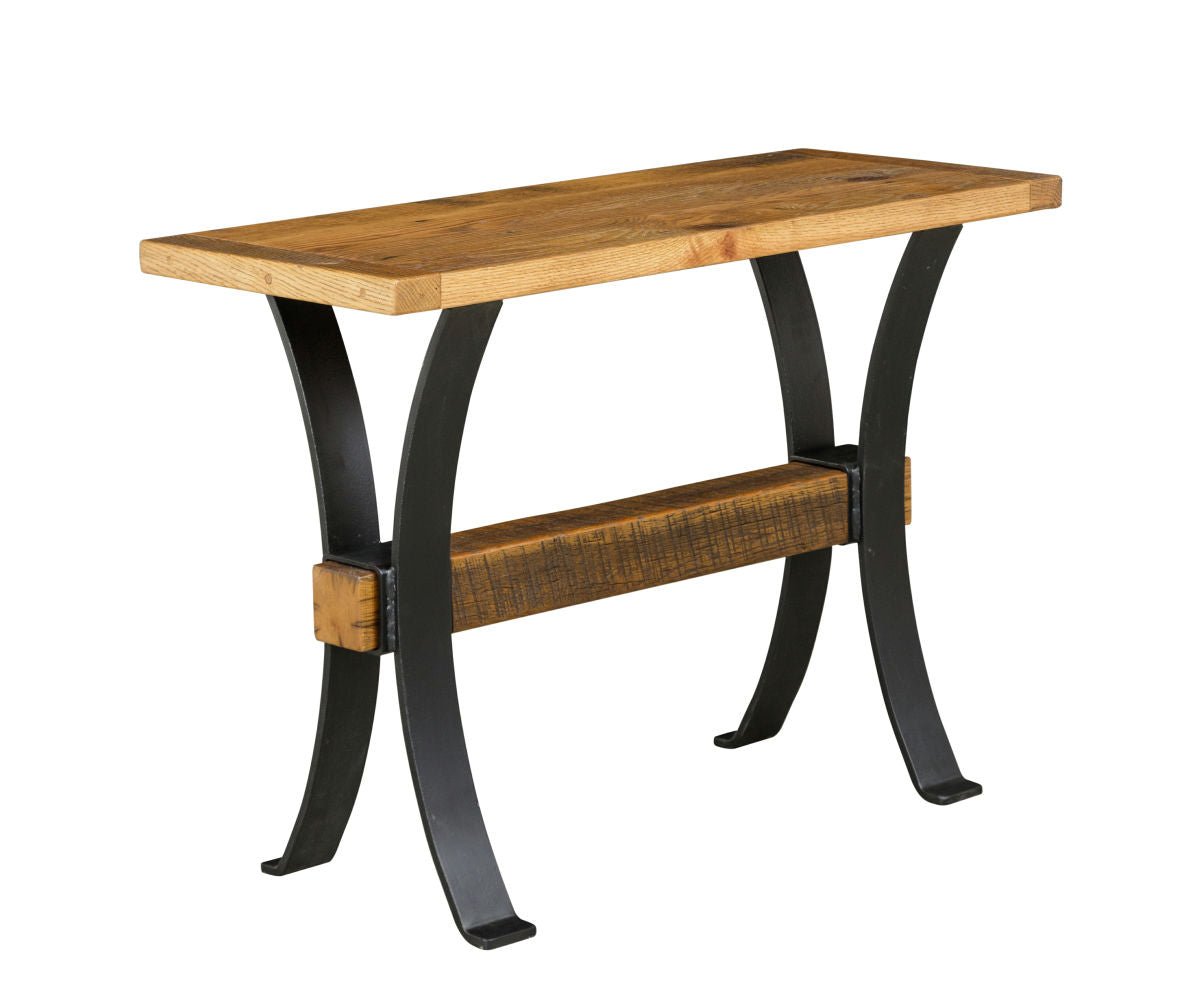Narrow reclaimed wood console table with a natural oak top on curved black steel legs joined by a rough sawn beam