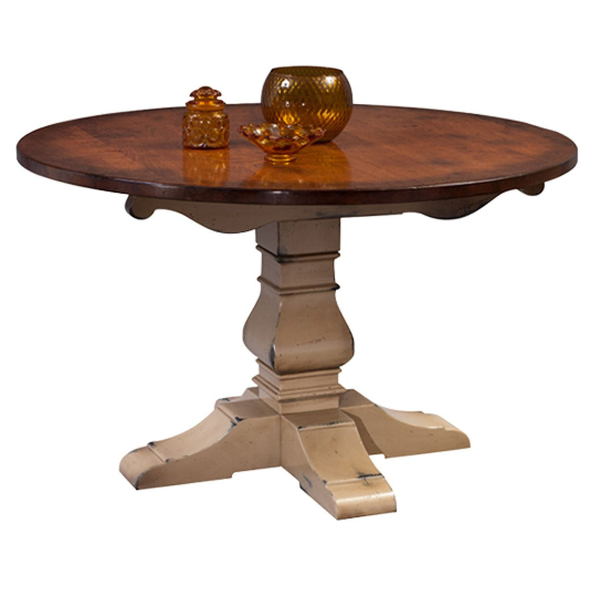 Two-tone round pedestal table with a rustic cherry top and a distressed cream painted turned pedestal base