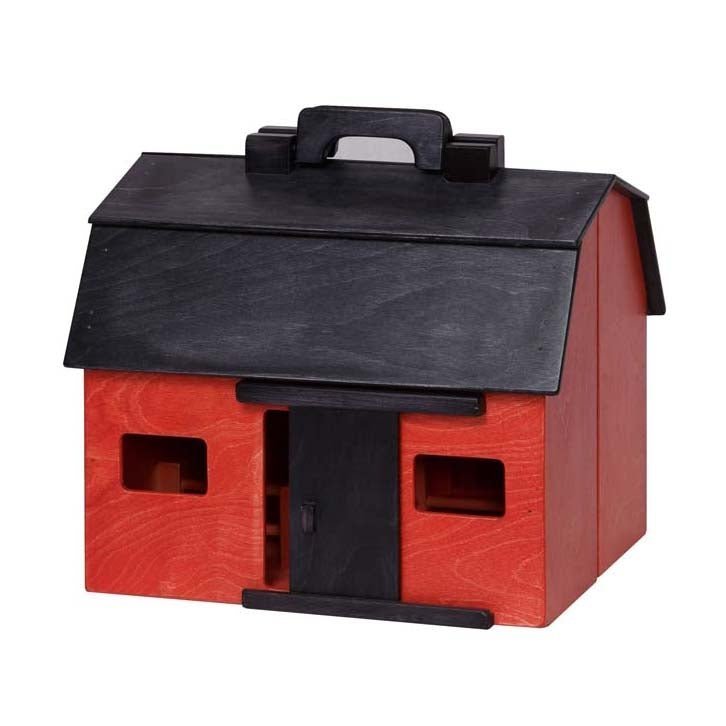 Red painted wooden folding toy barn closed into a carry case with a black gambrel roof, handle and cutout windows