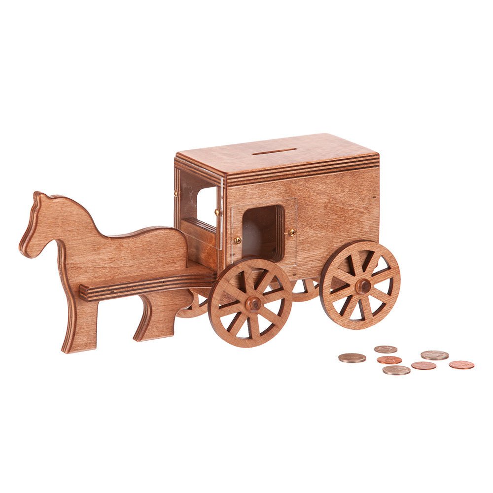 Wooden Amish horse and buggy coin bank in weathered gray with black spoked wheels and coins beside it