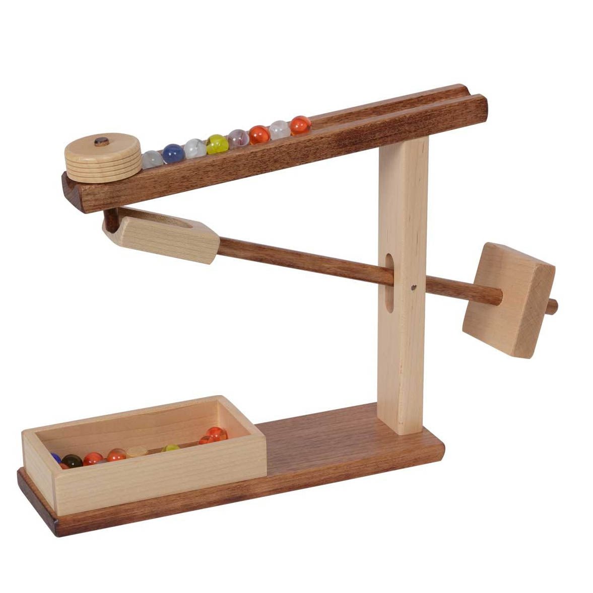 Two-tone walnut and maple marble machine with a ramp of colored marbles, tipping lever and a wooden catch tray