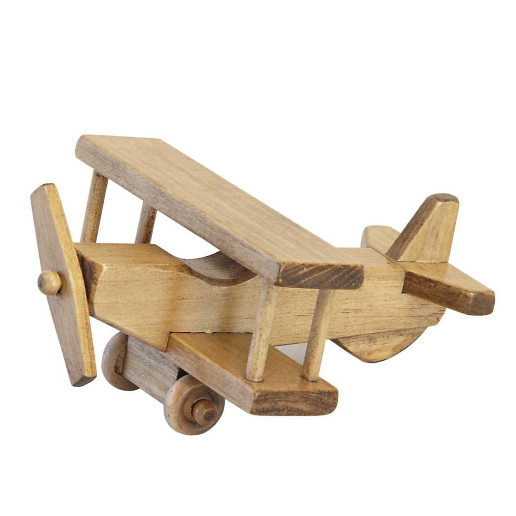 Small wooden toy biplane with double wings, wing struts, a turning propeller and two wooden wheels, natural stain