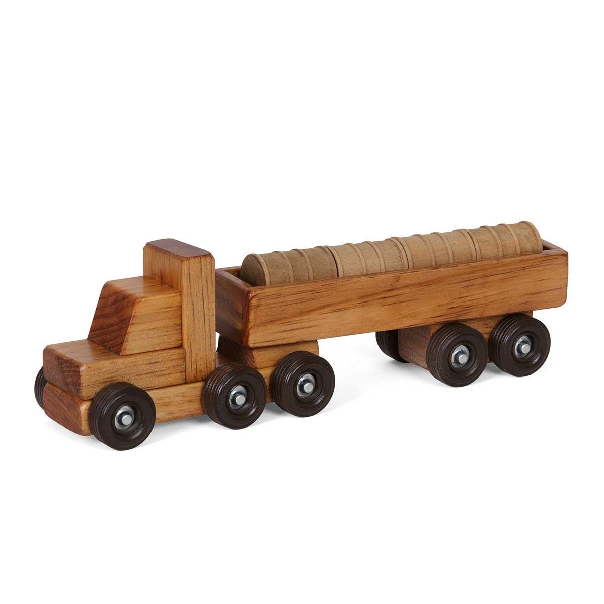 Wooden toy semi truck hauling a ribbed round barrel tank on its flatbed trailer with dark rubber wheels